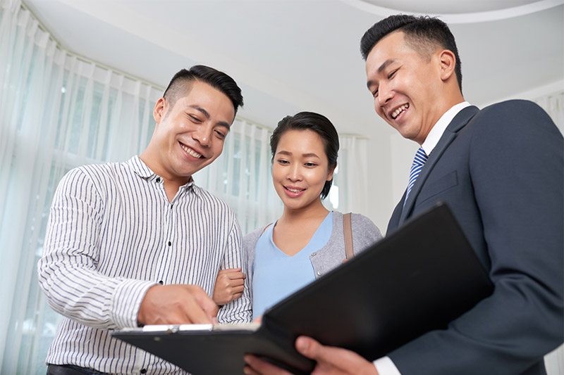 Couple talking to a realtor