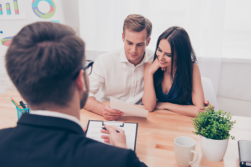 Couple talking to a loan officer