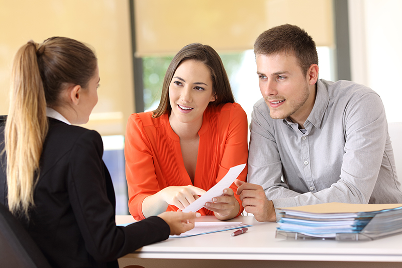 Couple talking to a realtor