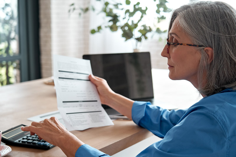 Woman looking over her bank statement